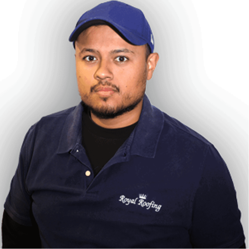 A man wearing a blue cap and a blue "Royal Roofing" polo shirt stands facing the camera against a plain background.