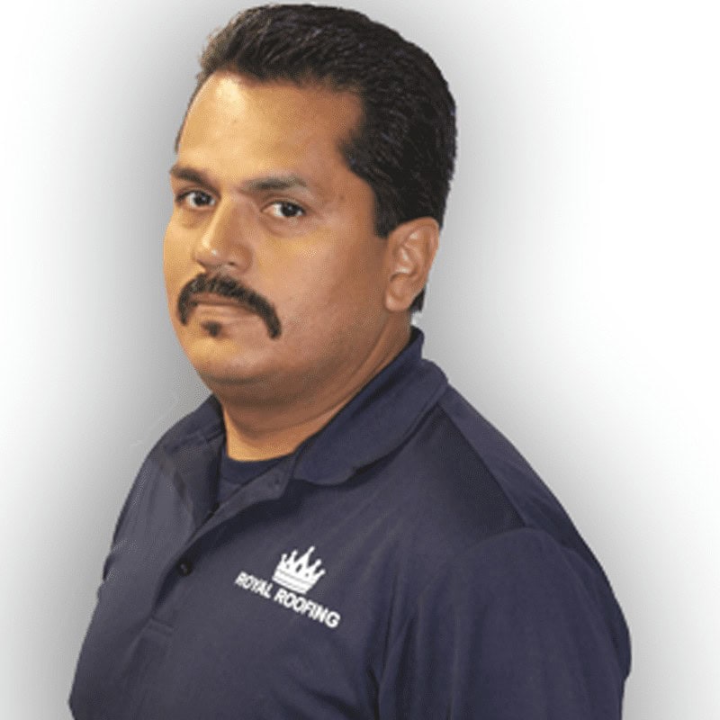 A man with a mustache wearing a navy blue "Royal Roofing" polo shirt poses against a light background.