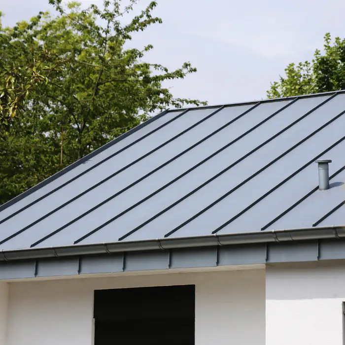 Modern metal roof on a sleek Orange County, CA home, showing clean lines, durable panels, and a polished contemporary exterior