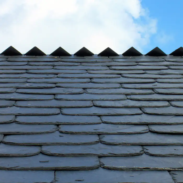 Slate roof close-up in Orange County, CA, showing neatly installed stone tiles with rich texture, strong lines, and lasting protection
