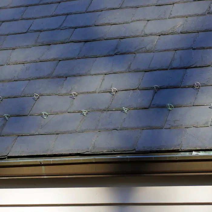 Close-up image of slate roofing in Orange County, California, highlighting the texture, pattern, and durability of natural stone tiles