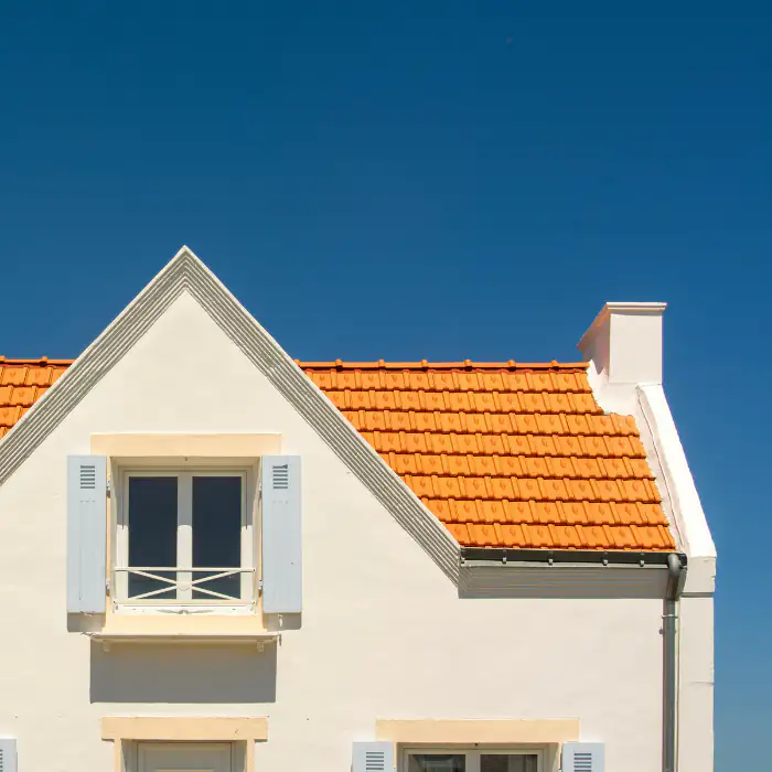 White House with a bright blue sky in Orange County, California, viewed from the front with clean lines and sunny weather