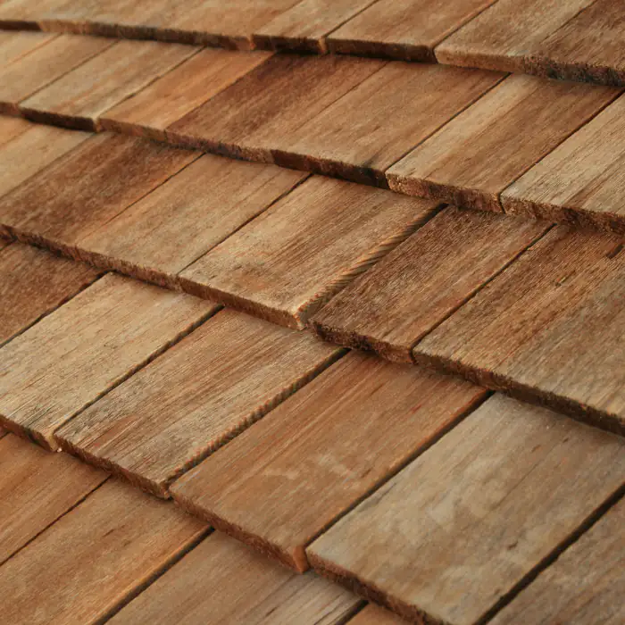 Weathered wooden roof shingles with layered texture on a residential roof in Orange County, California under bright natural light